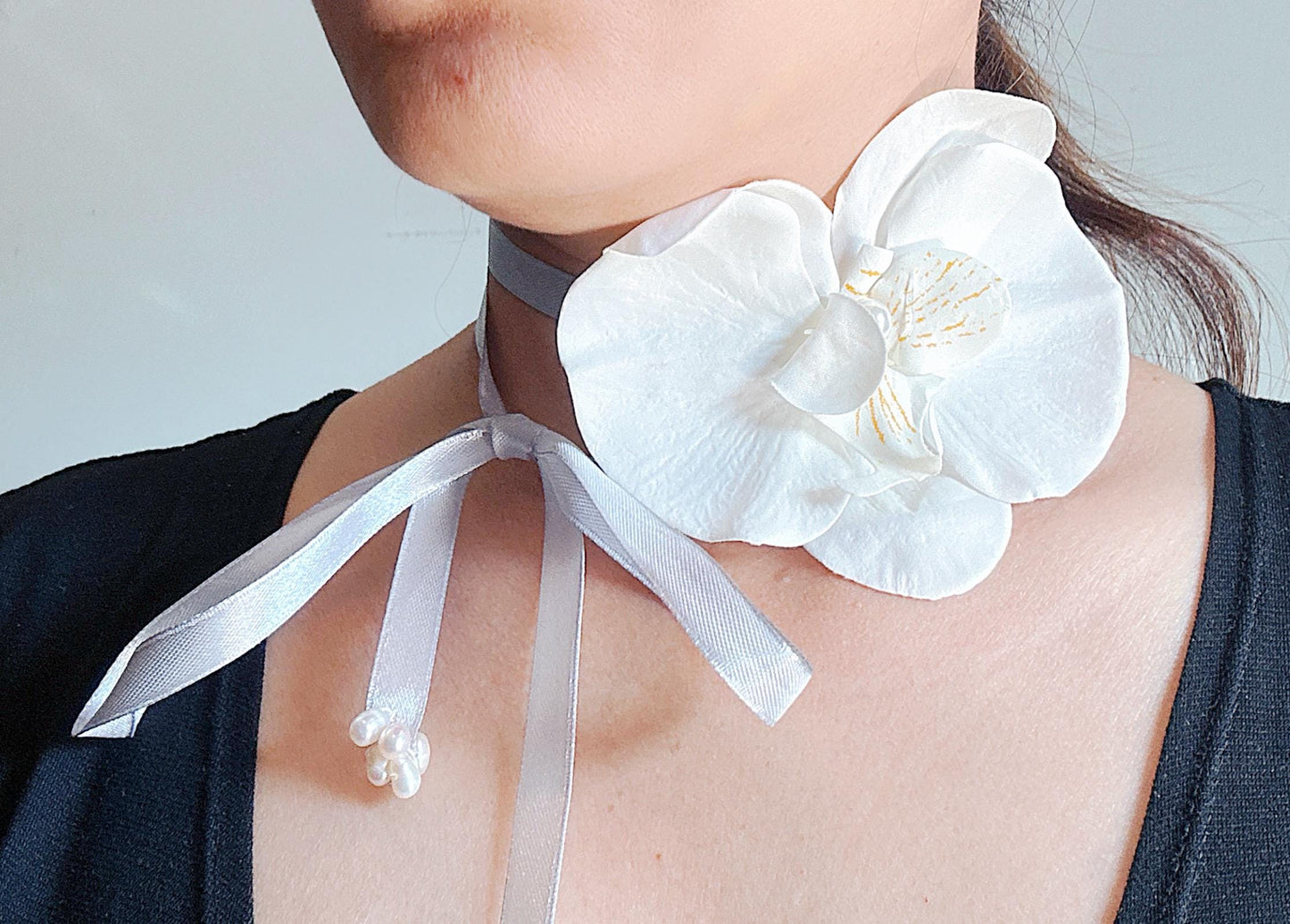 Handmade white orchid choker necklace with gray color ribbon end with freshwater pearls