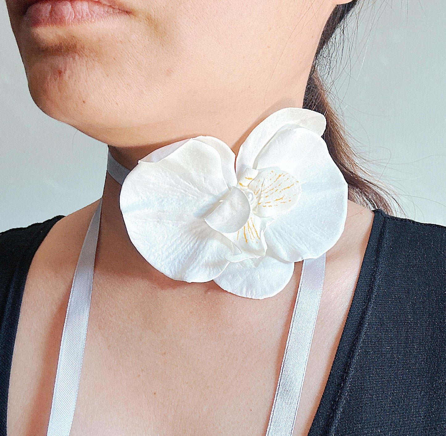 Handmade white orchid choker necklace with gray color ribbon end with freshwater pearls
