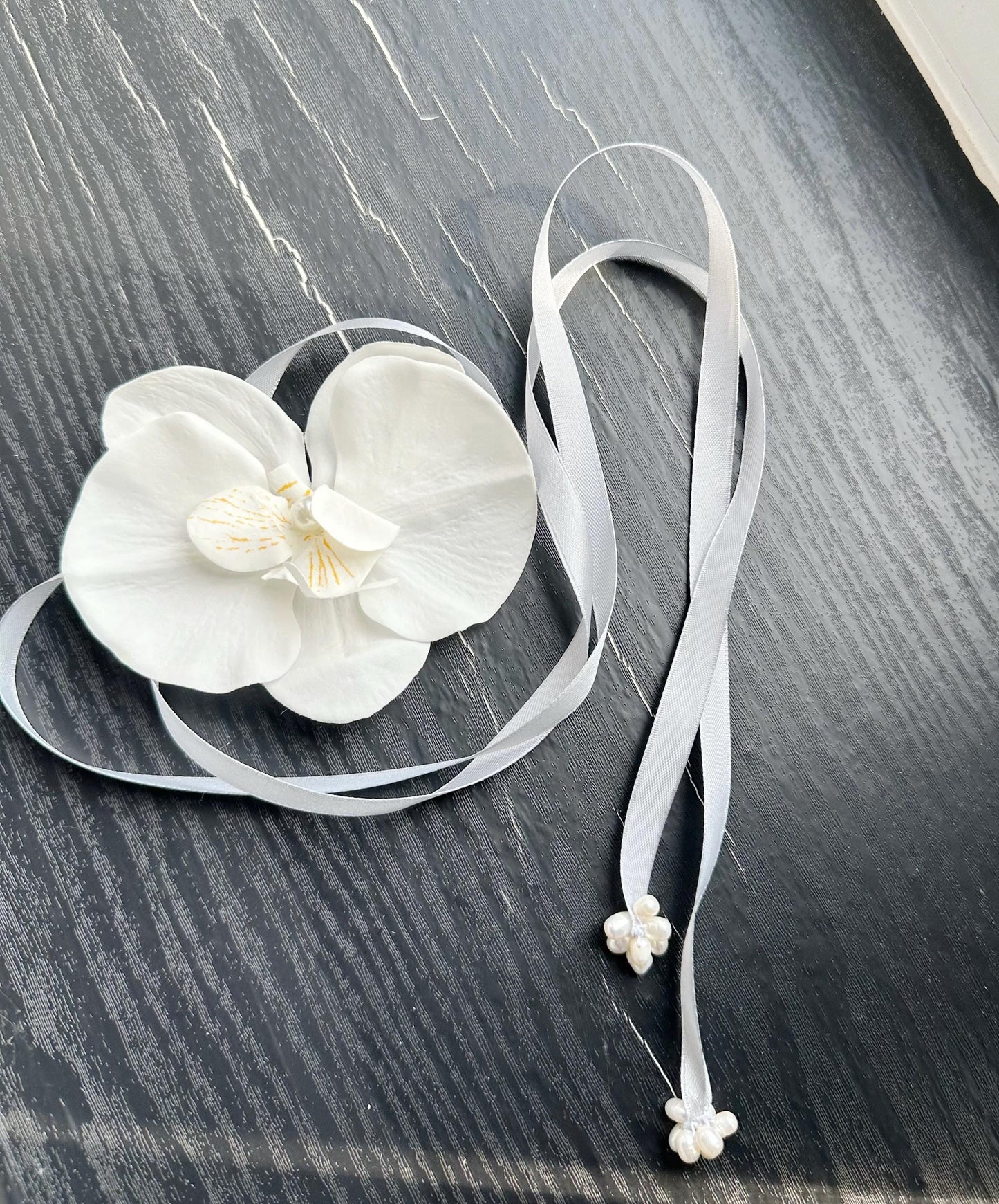 Handmade white orchid choker necklace with gray color ribbon end with freshwater pearls