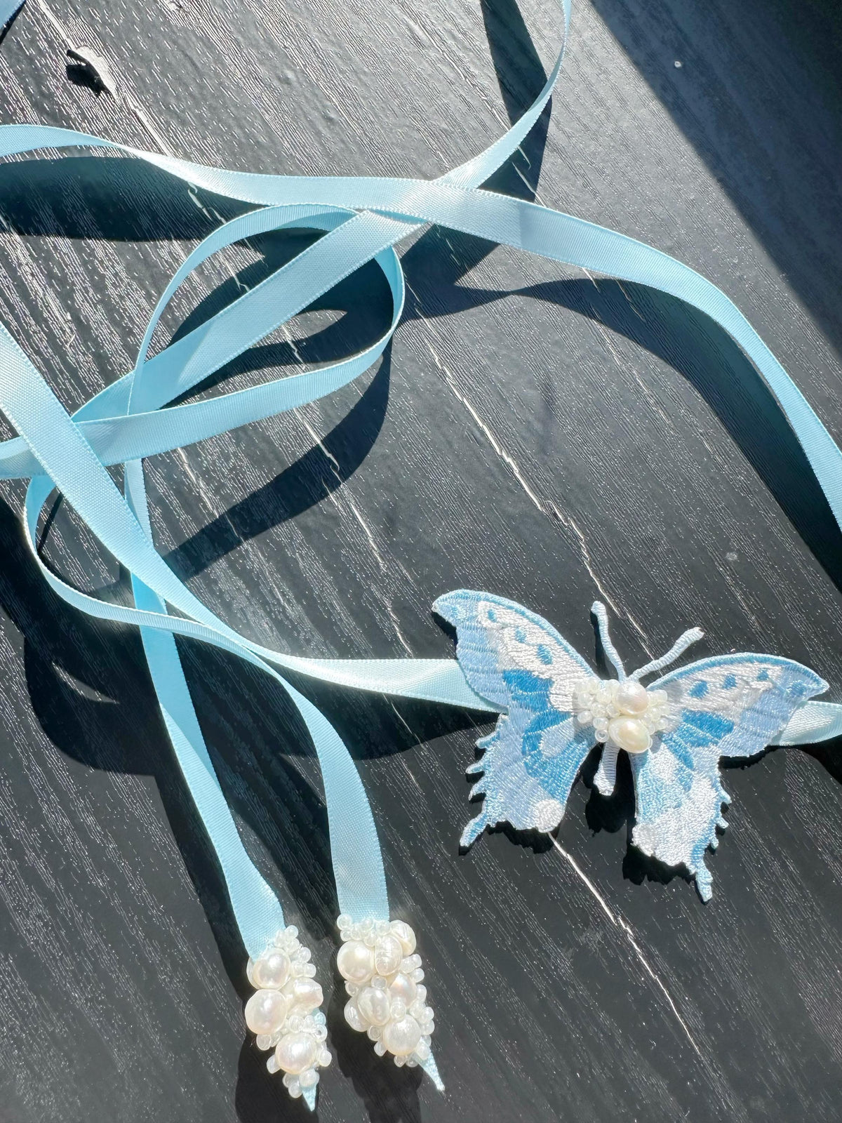 Handmade Choker featuring delicate hand-stitched embroidery of a blue butterfly, adorned with freshwater pearls and glass seed beads