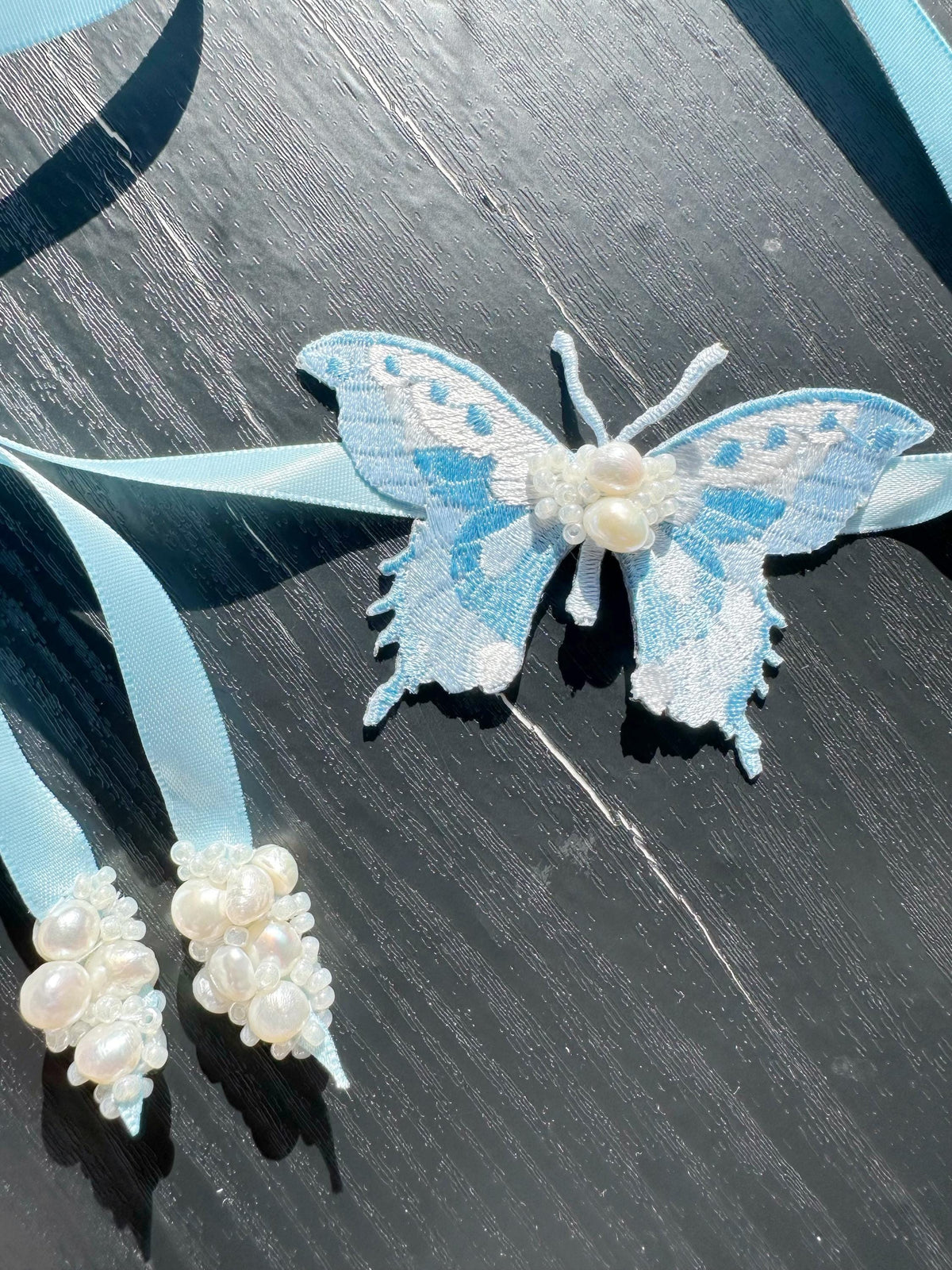 Handmade Choker featuring delicate hand-stitched embroidery of a blue butterfly, adorned with freshwater pearls and glass seed beads