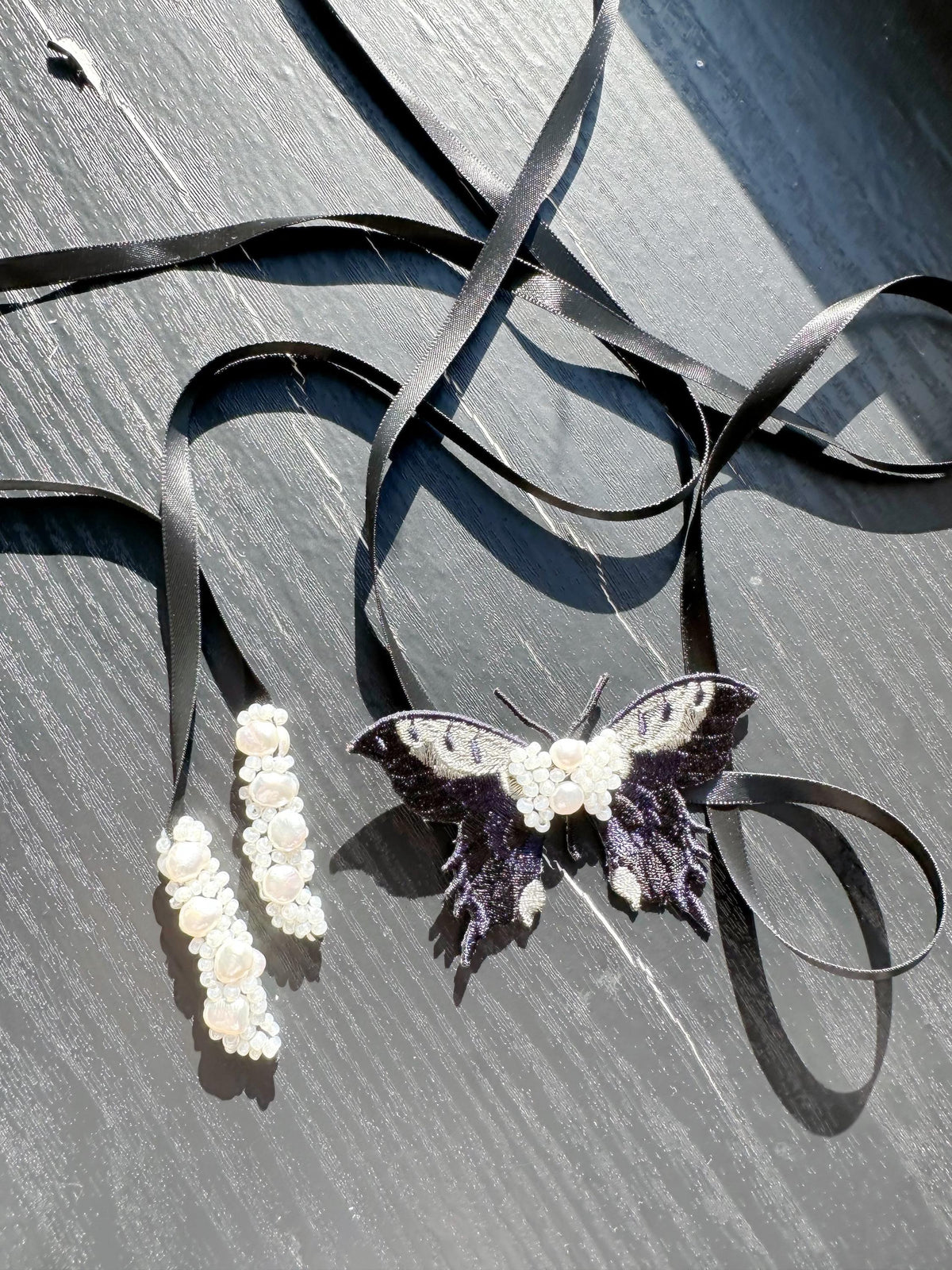 Handmade Choker featuring delicate hand-stitched embroidery of black color butterfly, adorned with freshwater pearls and glass seed beads