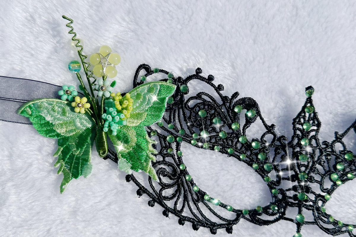 Handmade black lace masquerade mask with green color embroidered butterfly, green color rhinestones, and floral bead embellishments