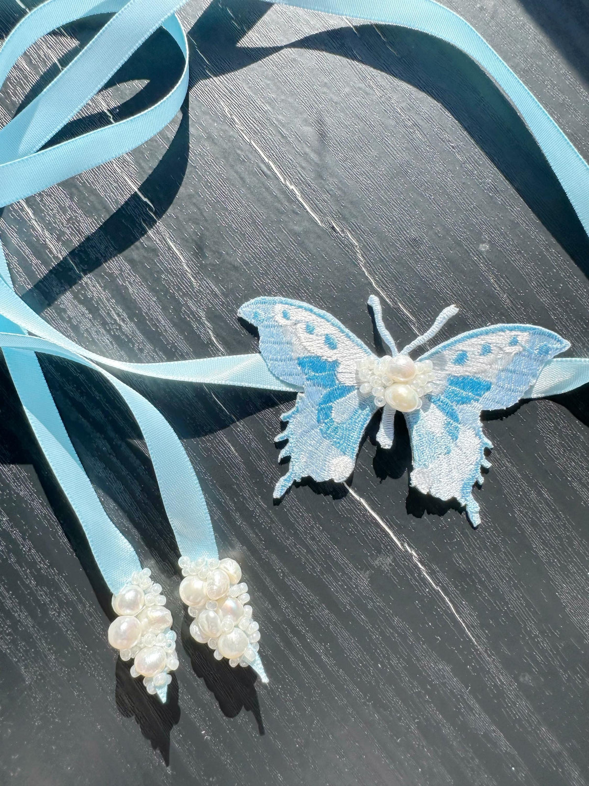 Handmade Choker featuring delicate hand-stitched embroidery of a blue butterfly, adorned with freshwater pearls and glass seed beads