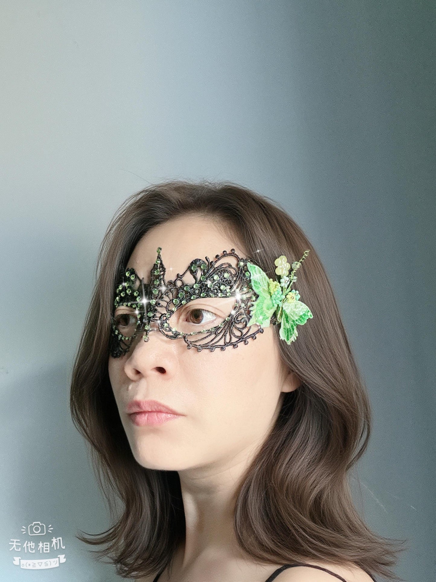 Handmade black lace masquerade mask with green color embroidered butterfly, green color rhinestones, and floral bead embellishments
