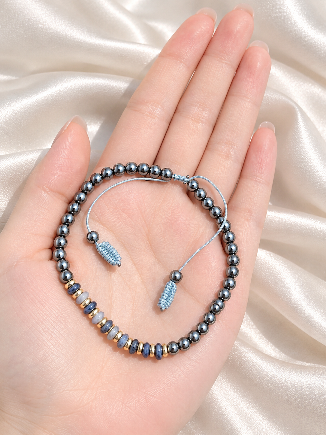 Handmade Bracelet for HIM OR HER. Made with 4mm Black Hematite, 2x4mm Blue White Sodalite, 14k gold plated spacer, Adjustable knotted Cord