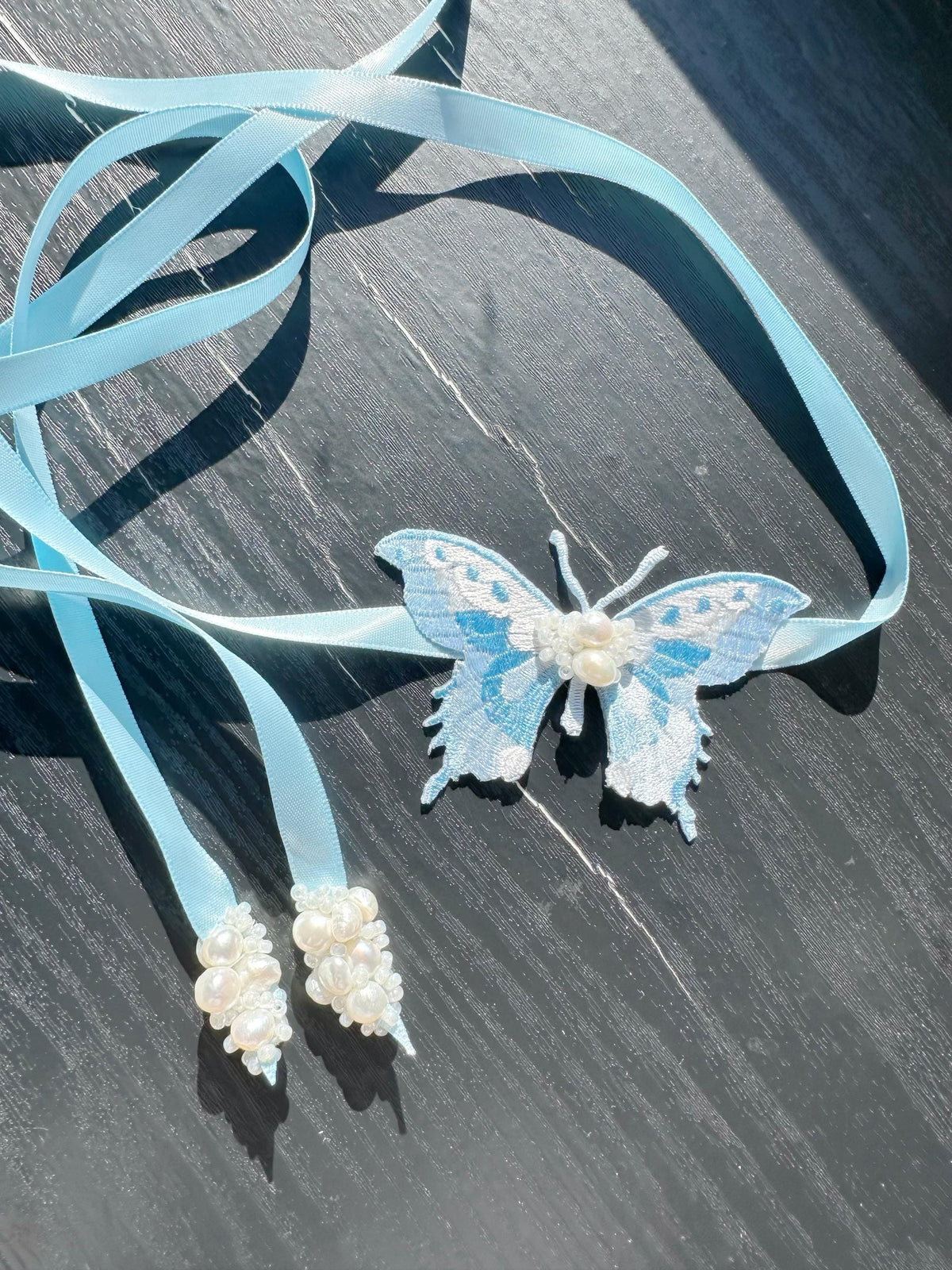 Handmade Choker featuring delicate hand-stitched embroidery of a blue butterfly, adorned with freshwater pearls and glass seed beads