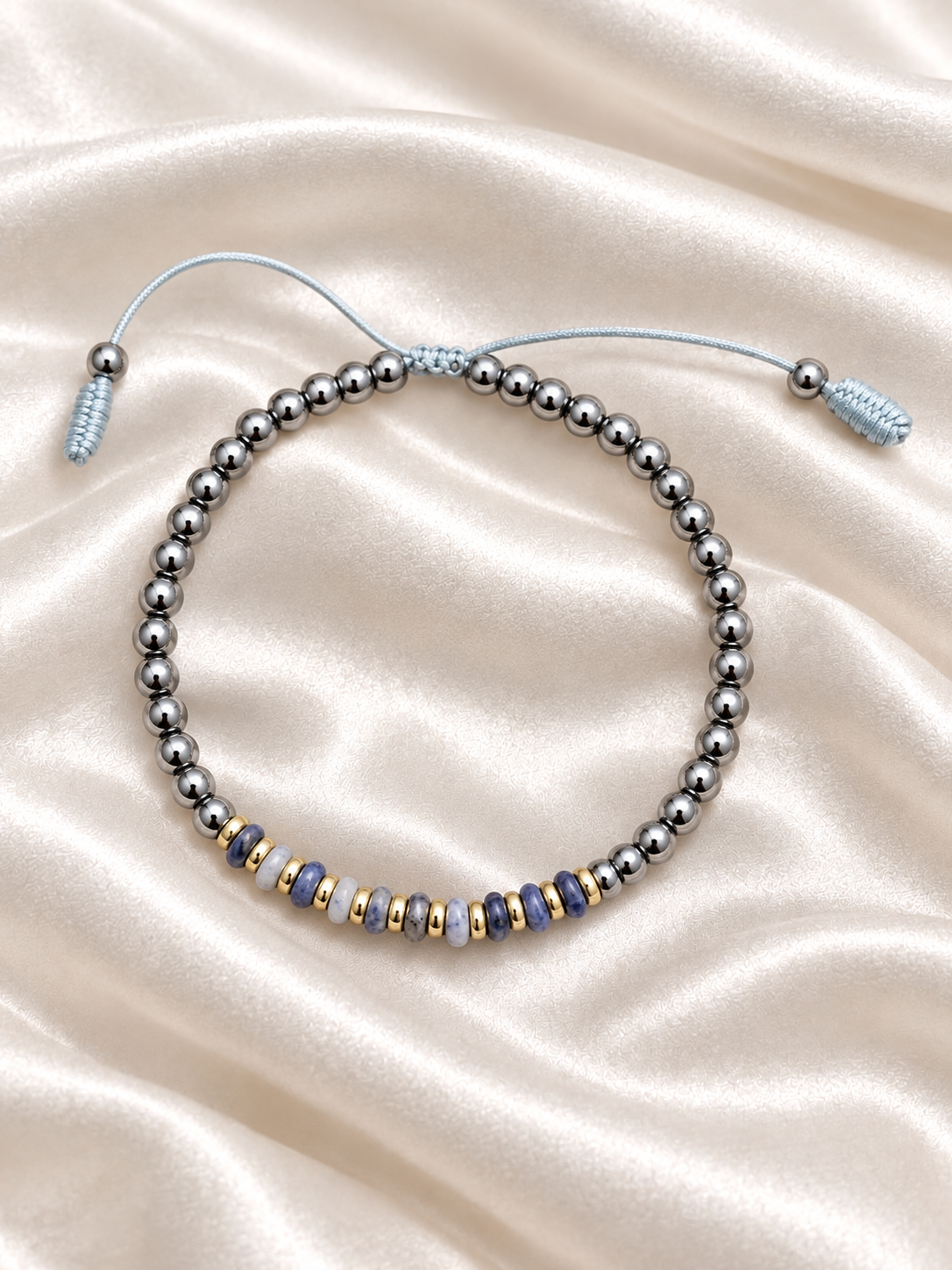 Handmade Bracelet for HIM OR HER. Made with 4mm Black Hematite, 2x4mm Blue White Sodalite, 14k gold plated spacer, Adjustable knotted Cord