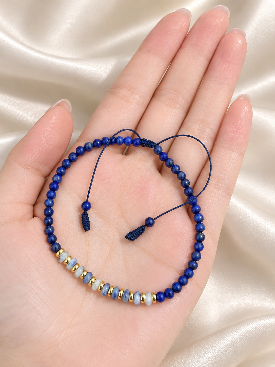 Handmade Bracelet for HIM OR HER. Made with 3mm lapis lazuli, 14K Gold Plated Spacer Beads, 2x3mm Blue and white Sodalite. Adjustable knotted Cord