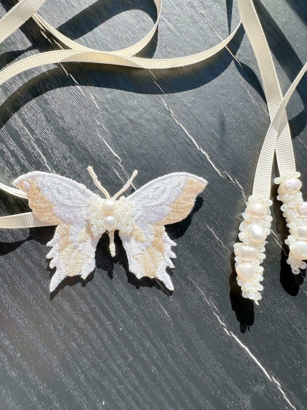 Handmade Choker featuring delicate hand-stitched embroidery of a Ivory color butterfly, adorned with freshwater pearls and glass seed beads