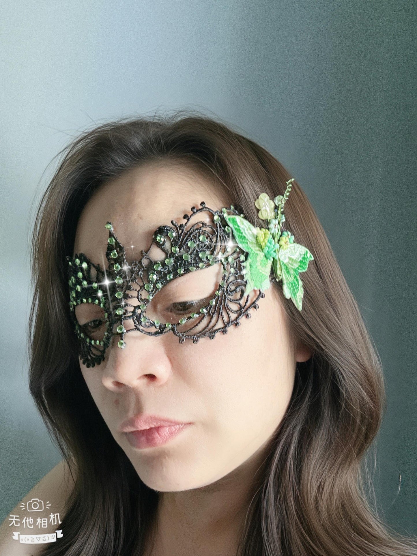 Handmade black lace masquerade mask with green color embroidered butterfly, green color rhinestones, and floral bead embellishments