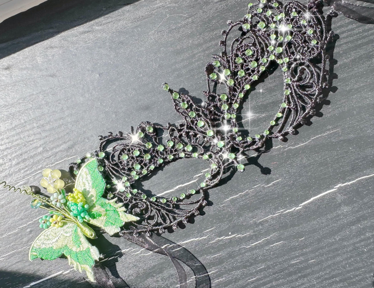 Handmade black lace masquerade mask with green color embroidered butterfly, green color rhinestones, and floral bead embellishments
